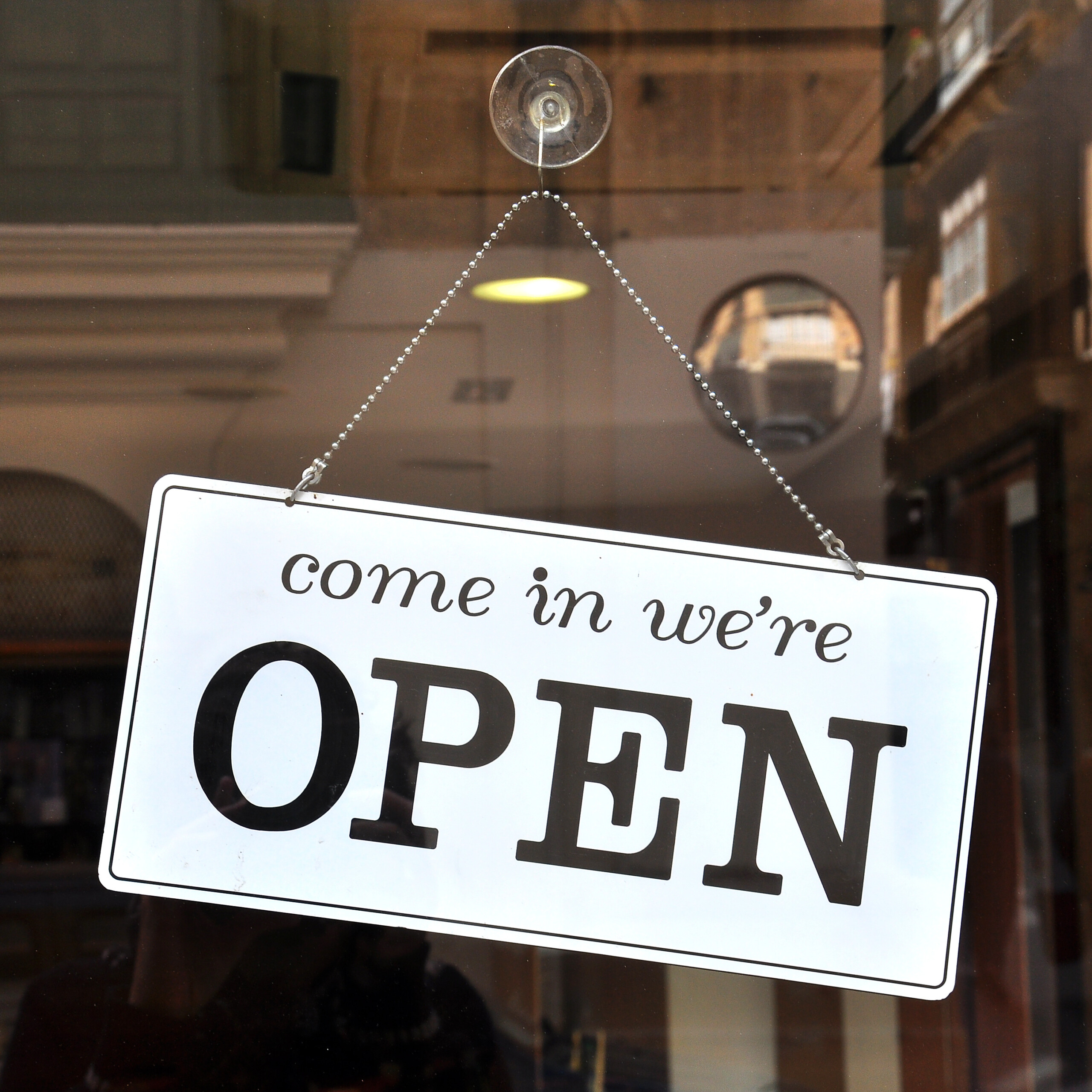 Open sign in the store Invest North – Launch